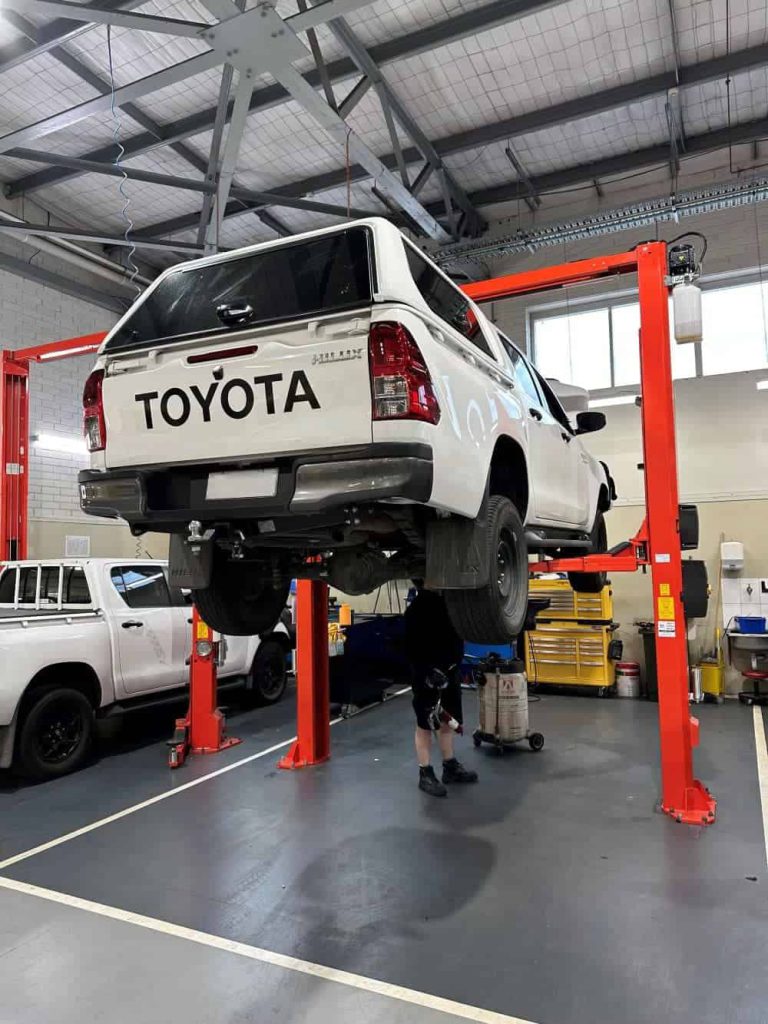 CM255-A 2 post hoist in busy workshop environment